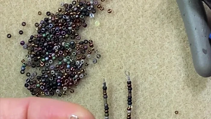 Attach the clasp and extender chain: Attach the lobster clasp to one end and the extender chain (if using) to the other end.