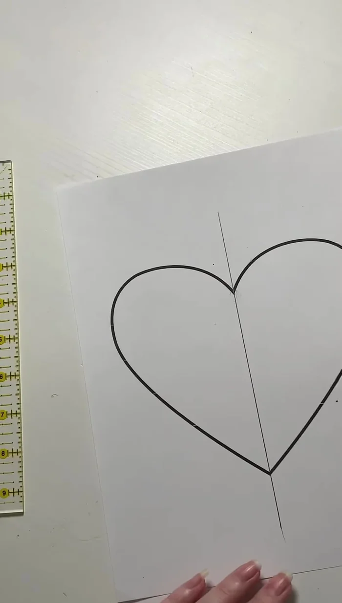 Draw section lines: Begin with the longest straight line possible within a section, then add more lines to create smaller sections, ensuring that all lines start and end at the edge of your fabric piece or at a previously drawn line.