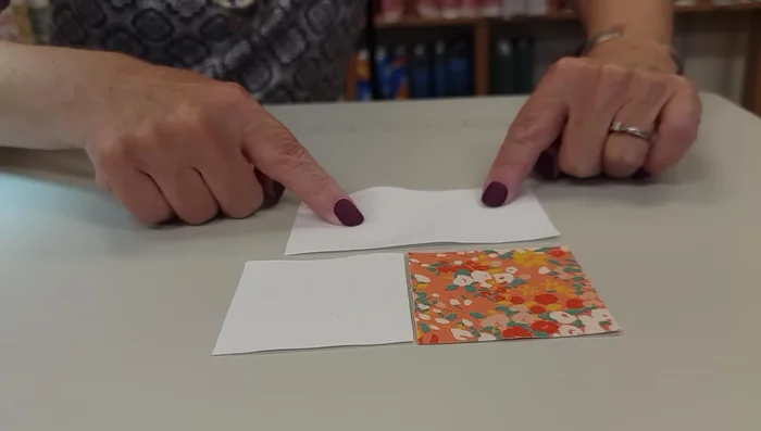 Create the flying geese units. Draw diagonal lines on the light squares, stitch along the lines, and press seams carefully according to instructions given in the video to minimize bulk and create sharp points.
