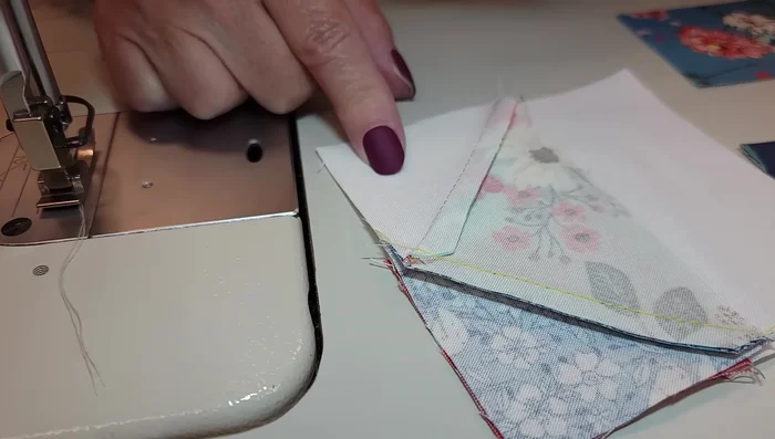 Stitch the main block components together, paying attention to seam alignment and pressing directions to maintain sharp points.