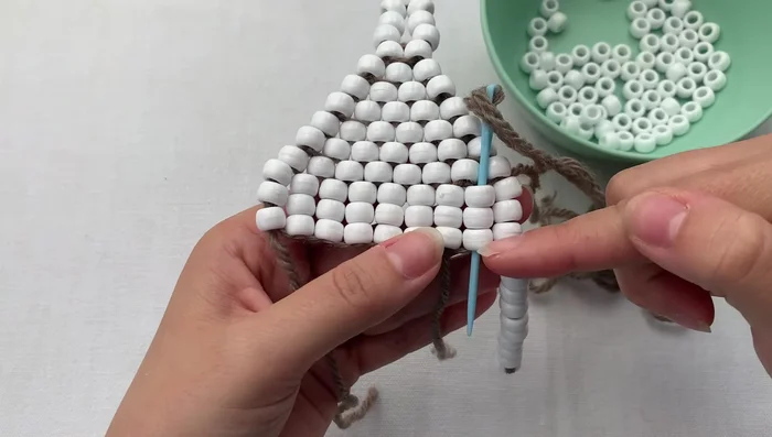 Repeat steps 6 and 7 to create multiple fringes, adjusting tension to prevent gaps or stiffness.