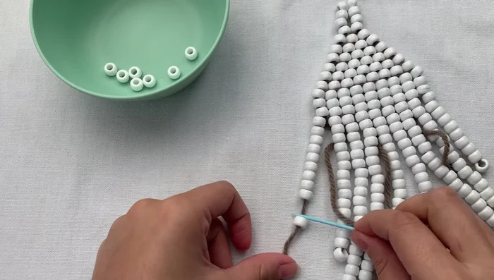 Weave the remaining thread through the foundation to hide and secure it. Trim excess thread.