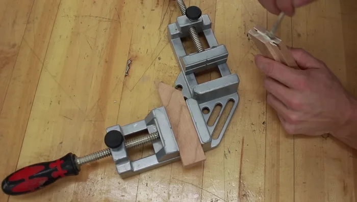 Glue the mitered pieces and spline together using a corner clamp.