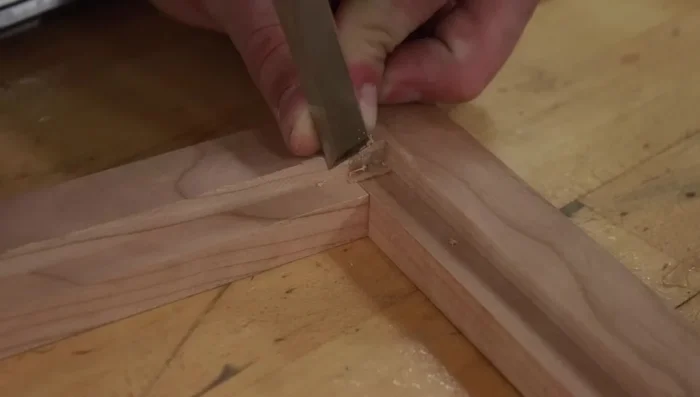 Square up the rabbet with a knife and chisel.