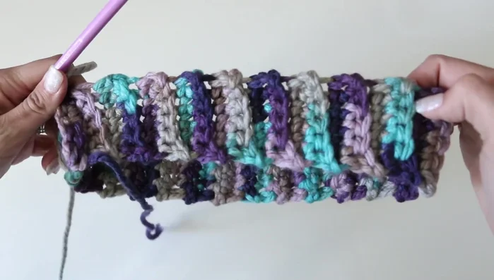 Single crochet around the entire cuff.