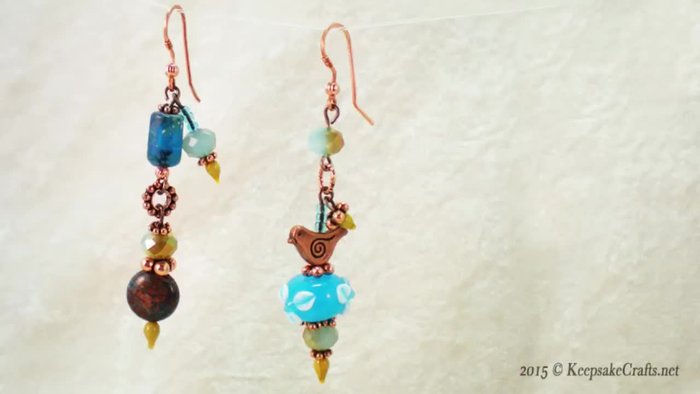 Gather materials: art glass head pins, copper ear wires, lampwork beads, small beads, chain nose pliers, wire cutters, and round nose pliers.