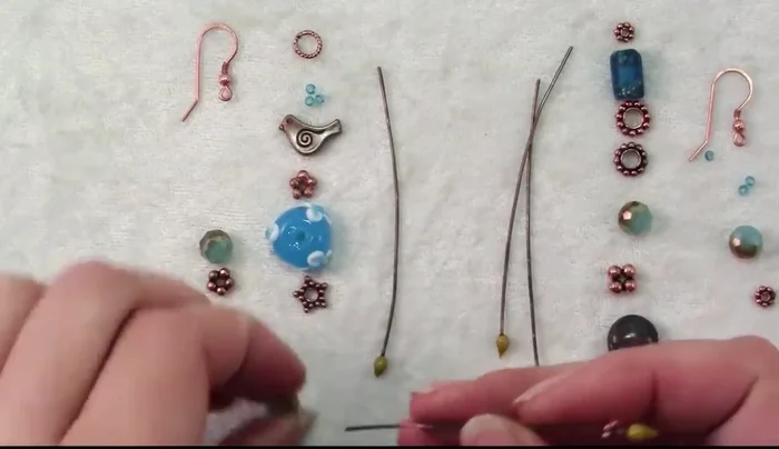 Attach the ear wire: Open the loop of the ear wire and slide it onto the earring assembly (177.88).