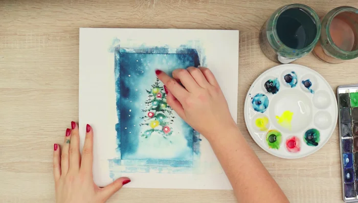 Blend the paint around the lights to create a smooth transition from the white paper to the colored lights.