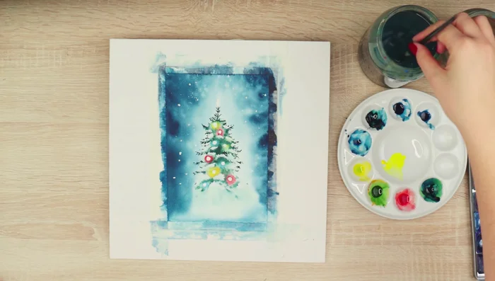 Blend the paint around the lights to create a smooth transition from the white paper to the colored lights.