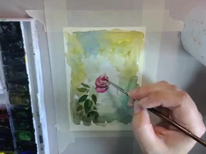 Continue with the flowers. Draw a line and soften it with water. Work slowly.