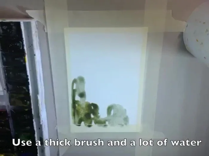 Leave the center of the page white and soften the edges with tissue paper.