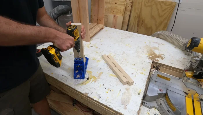 Attach the side frames together using pocket holes and 2x2s: