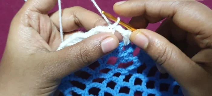 Second round: Slip stitch into chain two spaces, repeat the corner pattern, and continue the pattern around the runner.