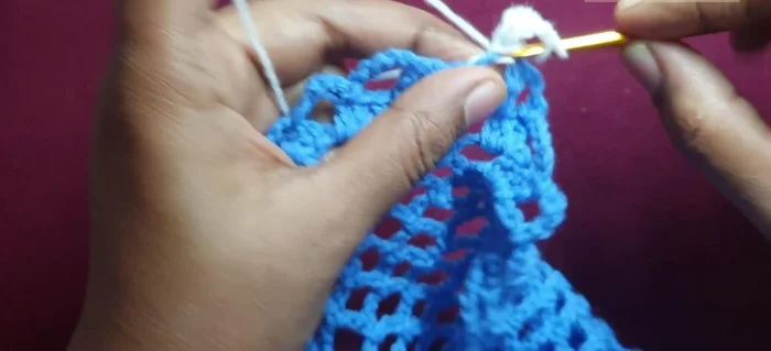 Continuing the pattern around to complete the first round.