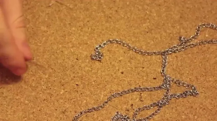 Tie another knot at the end to secure the floss.