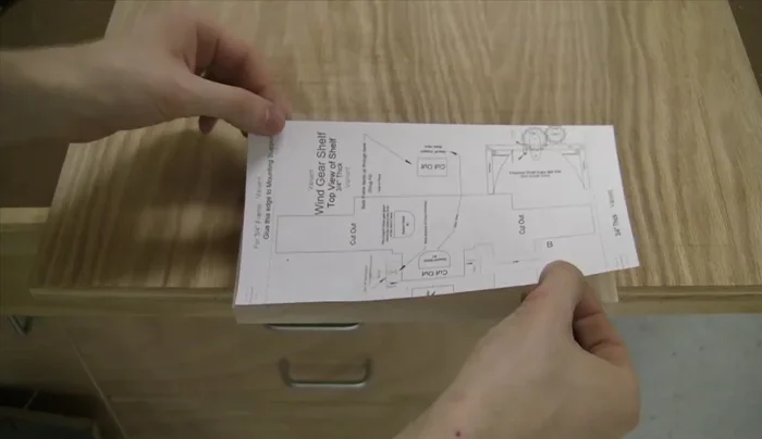 Use a dado stack at the table saw to create the wine shaft support.