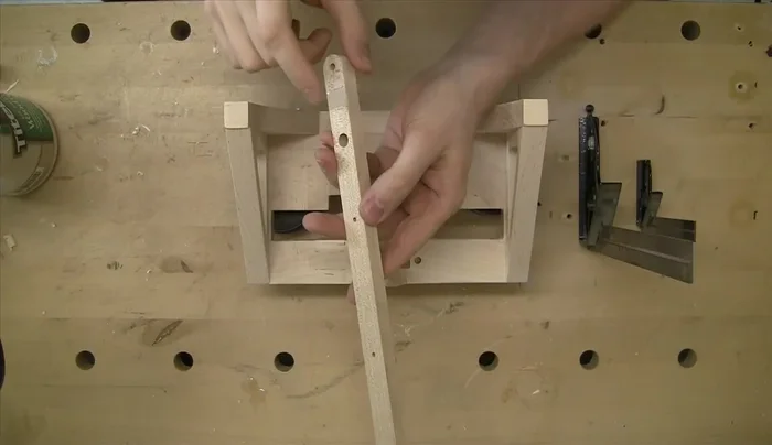 Polish the brass shafts before pressing them into the rear vertical frame using an arbor press and dead blow hammer.