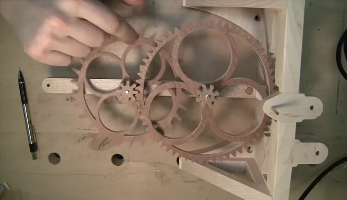 Fine-tune the gears by manually spinning them and using a rotary tool to relieve material where the gears bind.