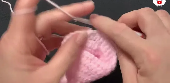 Row fifteen: Change yarn color. Chain 3. Single crochet in each chain-1 space, chain 3, repeat around.