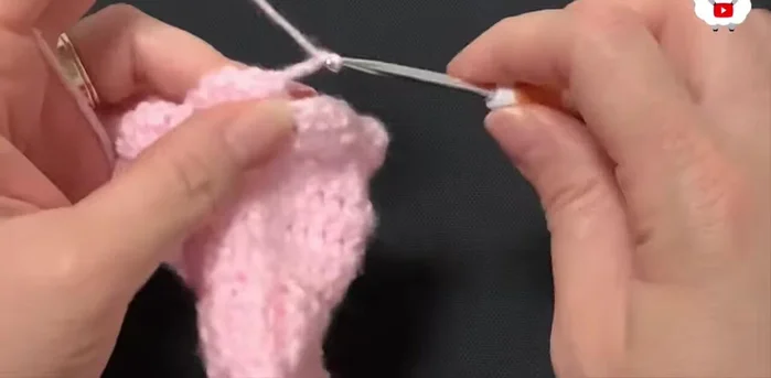 Row fifteen: Change yarn color. Chain 3. Single crochet in each chain-1 space, chain 3, repeat around.