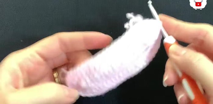 Insert hook into the stitch, grab a loop, and bring it through the front. Chain 2 (these chains don't count as stitches). Make double crochets around, joining to the first double crochet (not chains) of each section. You should end with 56 double crochets.