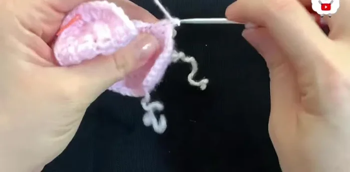 Continue making double crochets around for the first row, joining with a slip stitch at the end (56 double crochets).