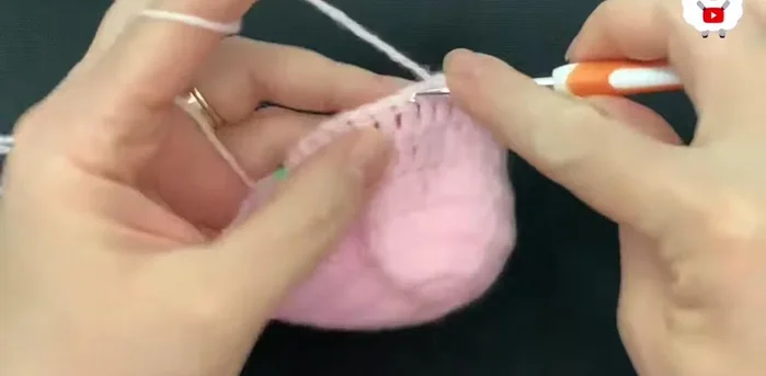 For the fifth row, chain 2. Work 10 double crochets, reduce stitches in the next four, work 14 double crochets, reduce stitches in the next four, and finish with 10 double crochets (30 double crochets).