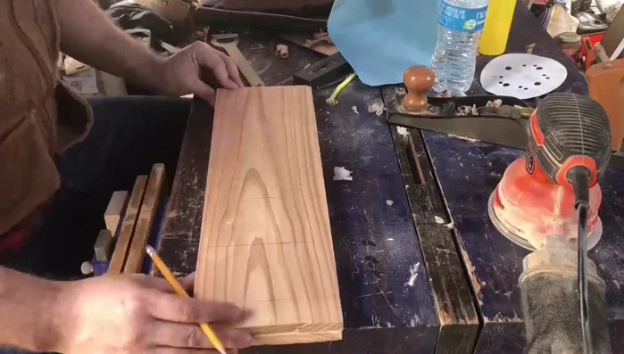 Design the nameplate using Inkscape (or a similar program) to create an SVG file. Print out the design, including overlapping letters, and glue it to the wood.