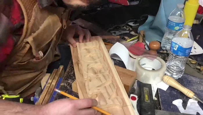 Design and cut out the backdrop using a scroll saw. Cut outside the lines initially; you will clean up the edges with a sander.