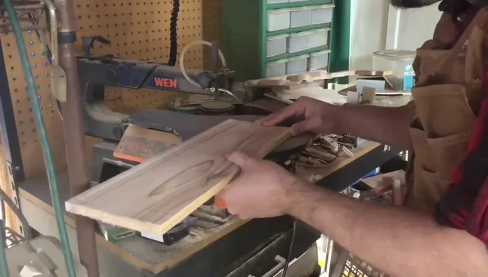 Sand the backdrop smooth. Optionally, route the edges using a cove bit for a decorative finish.