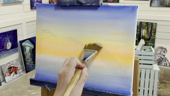 Add a touch of blue, yellow, orange, and white mixture to create soft purple shadows across the sky.