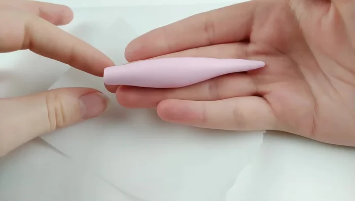 Roll out clay, elongate neck and tail. Shape head into a cone. Attach the head to the body.