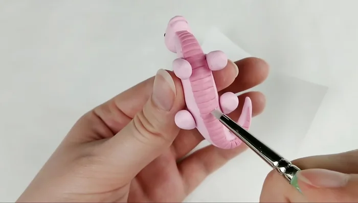 Add scaled belly and toes (as shown in previous examples).