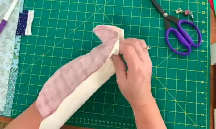 Use a loop presser (optional) to press the edges of your stocking.