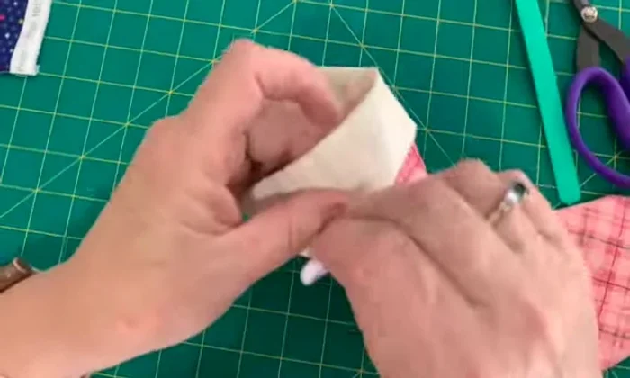 Add a hanging tab (optional) by stitching a small piece of fabric to the top.