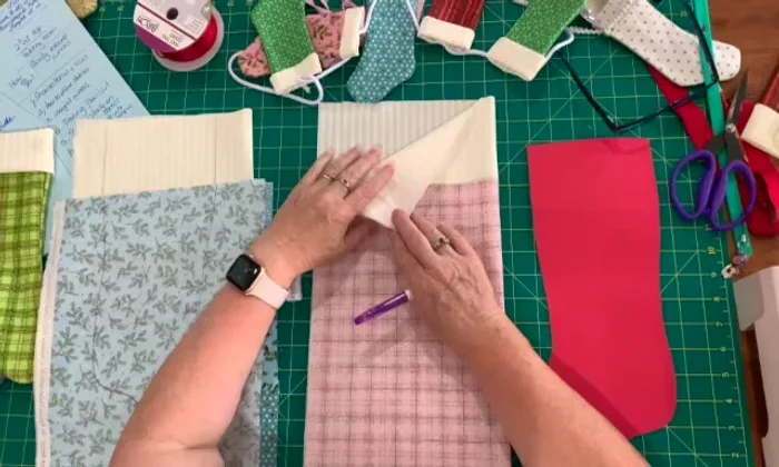 Place outer fabric on top of lining fabric, aligning edges.