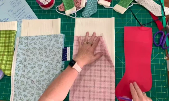 Place outer fabric on top of lining fabric, aligning edges.