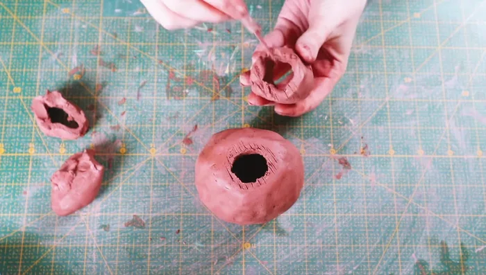 Score the top of the vase and the neck, then attach the neck with water, blending thoroughly.