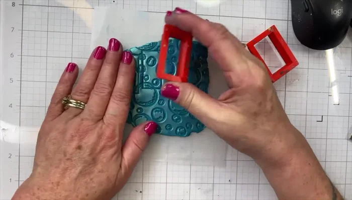 Cut out tiles: Use cookie cutters to cut your desired shapes from the clay sheet. Lift each piece individually to prevent stretching.