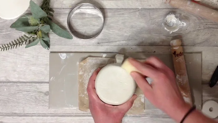 Let the mug dry completely, then smooth any imperfections.