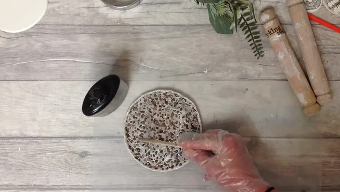 Apply UV resin, releasing bubbles with a flame, and cure under a UV lamp.