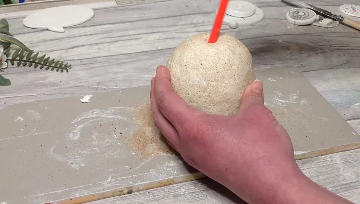 Pinch the edges to refine the vase's shape.
