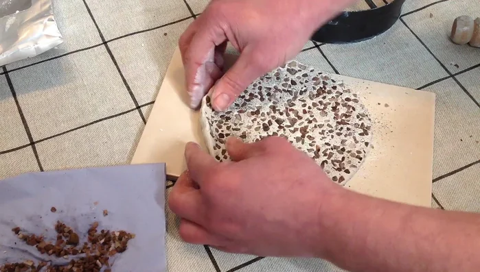 Pinch the sides of the clay to create a dish shape.