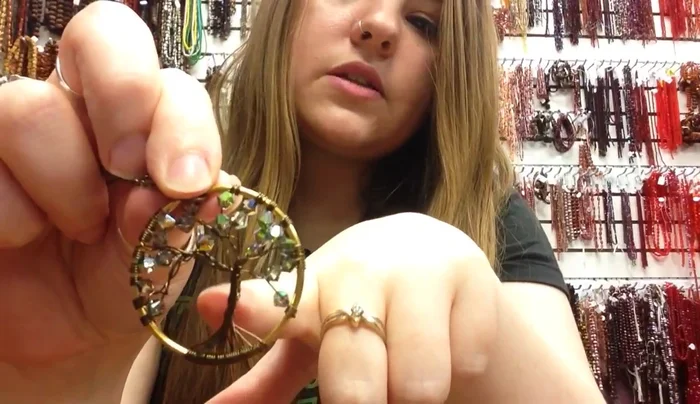 Form the trunk: Flip the wire roots upwards, and twist the wires together to create the tree's trunk, keeping your fingers low to control the twist.