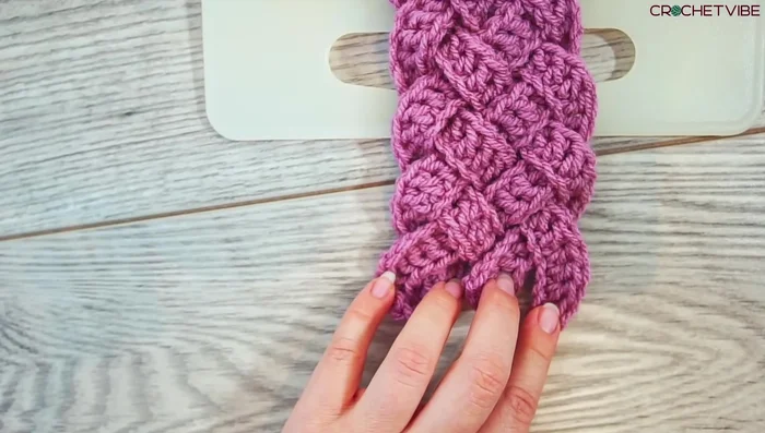 Sew the two ends of the braid together using a tapestry needle. Make sure to go through every strand several times to secure the seam.