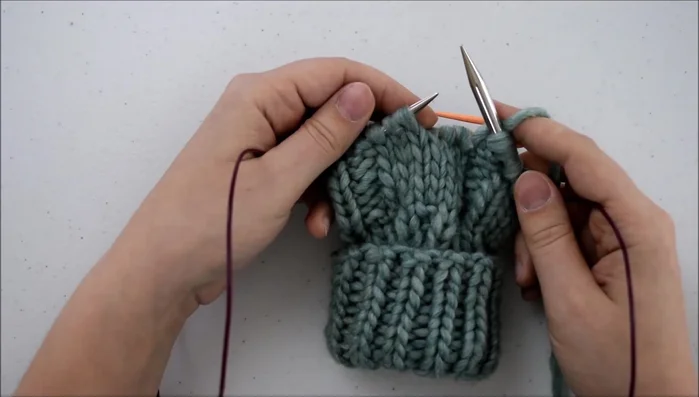 Knit the next three stitches.