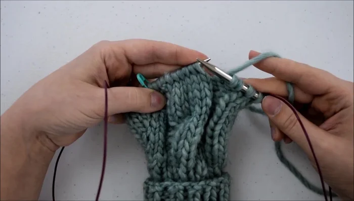 Knit the first three stitches.