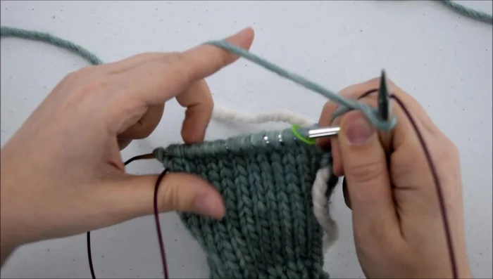 Slip the loop onto your needle and tighten.