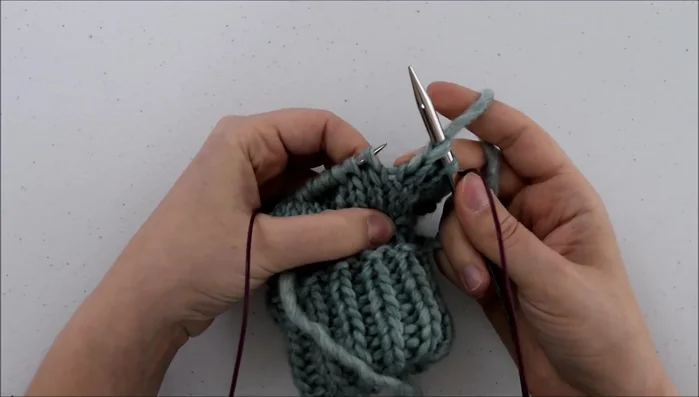 Knit through the back.