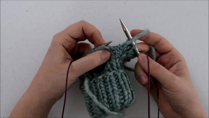 Knit through the back.